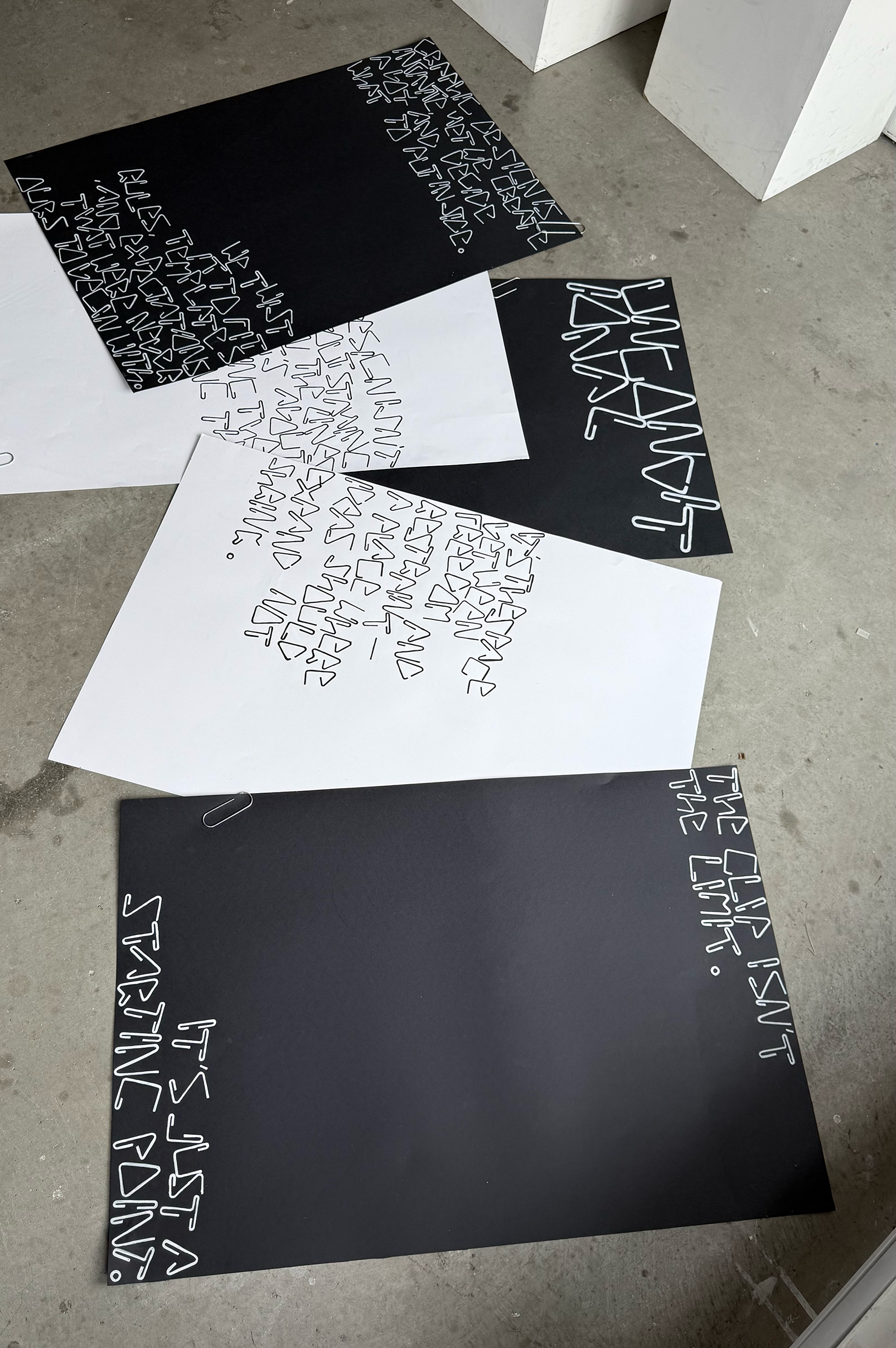 White book with red slanted lines on a brown coffee table