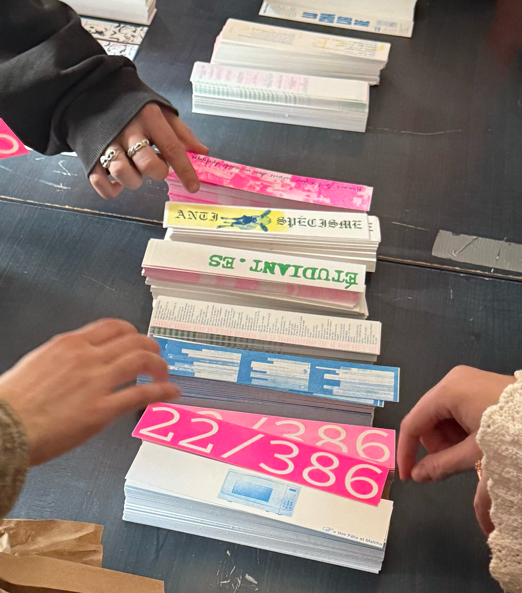 White book with red slanted lines on a brown coffee table